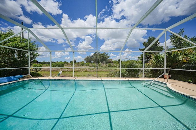 2193 Beacon Dr, Port Charlotte, FL 33952 - swimming pool with glass enclosure and a patio