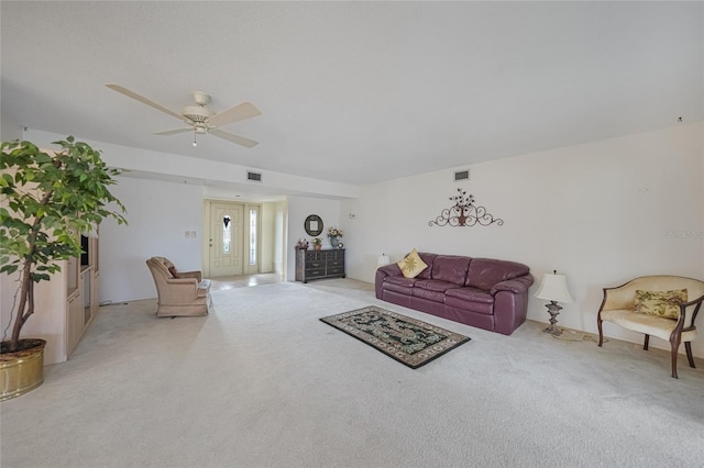 2193 Beacon Dr, Port Charlotte, FL 33952 - living room with light carpet and a ceiling fan
