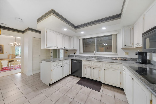 2193 Beacon Dr, Port Charlotte, FL 33952 - kitchen with black appliances, a sink, a chandelier, white cabinets, and light tile patterned flooring