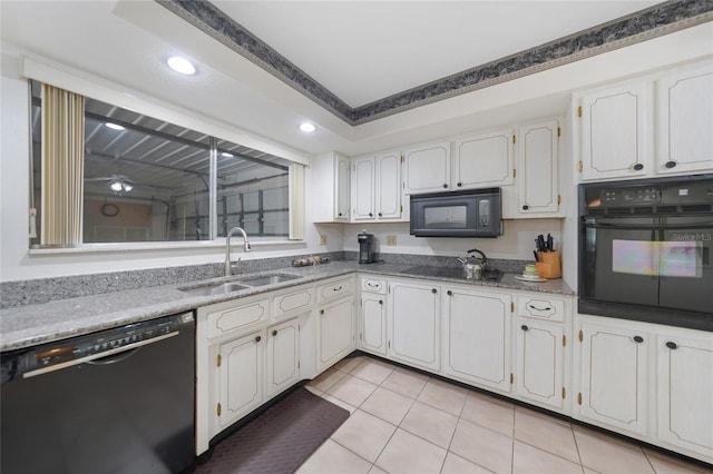 2193 Beacon Dr, Port Charlotte, FL 33952 - kitchen with black appliances, a sink, light tile patterned floors, white cabinetry, and recessed lighting