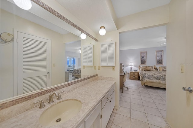 2193 Beacon Dr, Port Charlotte, FL 33952 - bathroom with ensuite bath, tile patterned floors, and vanity