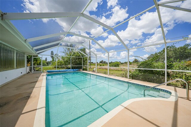 2193 Beacon Dr, Port Charlotte, FL 33952 - view of pool featuring a covered pool, a patio area, and glass enclosure