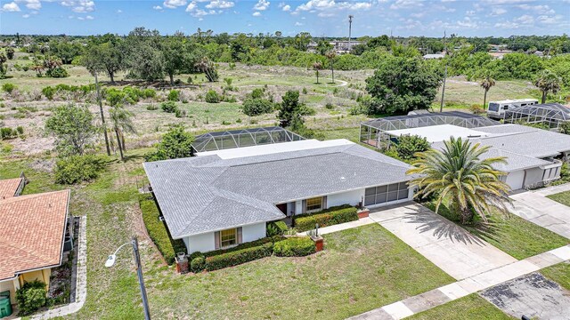 2193 Beacon Dr, Port Charlotte, FL 33952 - aerial view of property and surrounding area with a tree filled landscape