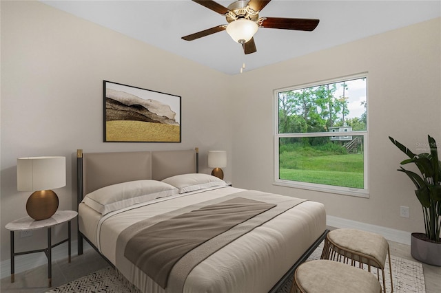 bedroom with baseboards and ceiling fan