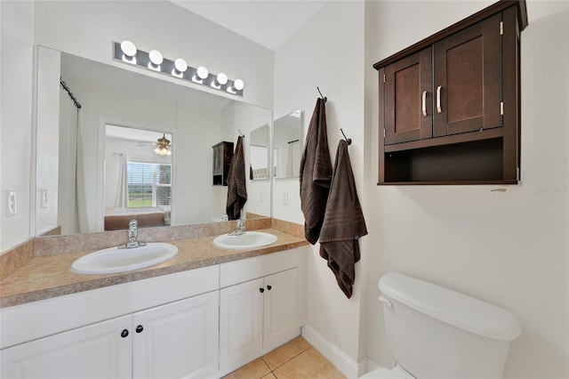 2160 Heron Lake Dr Unit 201, Punta Gorda, FL 33983 - bathroom featuring ensuite bath, toilet, tile patterned floors, and double vanity