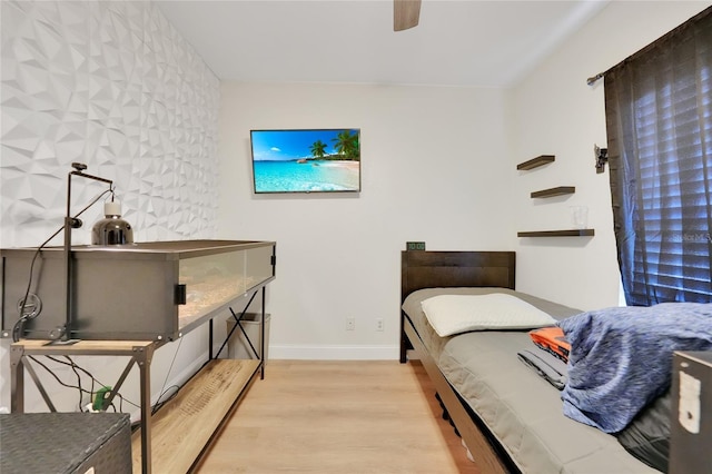 2160 Heron Lake Dr Unit 201, Punta Gorda, FL 33983 - bedroom with wood finished floors, baseboards, and a ceiling fan