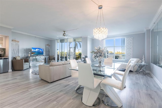 3329 Sunset Key Cir Unit 107, Punta Gorda, FL 33955 - dining space featuring light wood-type flooring, ornamental molding, ceiling fan, a chandelier, and baseboards
