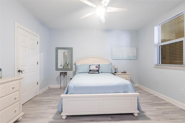 3329 Sunset Key Cir Unit 107, Punta Gorda, FL 33955 - bedroom with light wood-style floors, baseboards, and ceiling fan