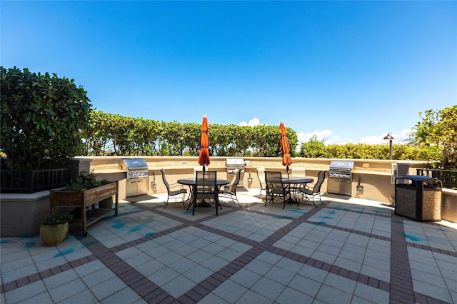 3329 Sunset Key Cir Unit 107, Punta Gorda, FL 33955 - view of patio featuring outdoor dining area