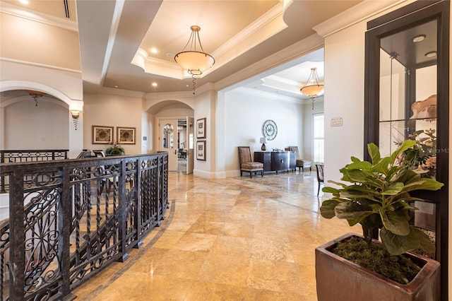 3329 Sunset Key Cir Unit 107, Punta Gorda, FL 33955 - corridor with arched walkways, ornamental molding, a raised ceiling, recessed lighting, and baseboards