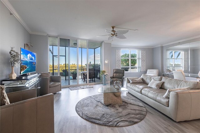 3329 Sunset Key Cir Unit 107, Punta Gorda, FL 33955 - living area featuring ornamental molding, wood finished floors, and a ceiling fan