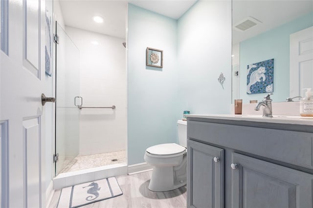 3329 Sunset Key Cir Unit 107, Punta Gorda, FL 33955 - bathroom featuring toilet, a shower stall, vanity, and recessed lighting