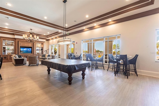 3329 Sunset Key Cir Unit 107, Punta Gorda, FL 33955 - rec room with billiards, crown molding, a tray ceiling, wood finished floors, and a chandelier