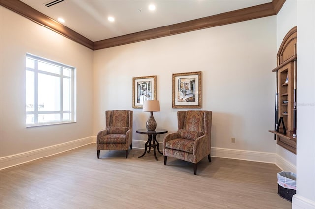 3329 Sunset Key Cir Unit 107, Punta Gorda, FL 33955 - living area featuring light wood-style flooring, crown molding, baseboards, and recessed lighting