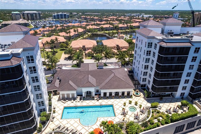 3329 Sunset Key Cir Unit 107, Punta Gorda, FL 33955 - drone / aerial view of a pool area and a nearby body of water