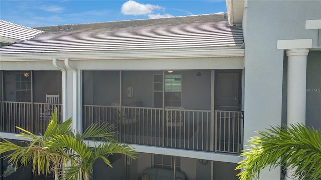 14267 Heritage Landing Blvd Unit 1223, Punta Gorda, FL 33955 - view of property exterior featuring a tile roof, stucco siding, and a sunroom