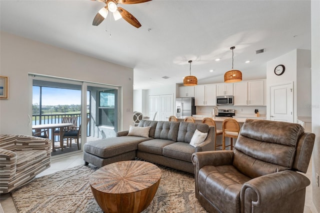 14267 Heritage Landing Blvd Unit 1223, Punta Gorda, FL 33955 - living room featuring ceiling fan and light tile patterned floors