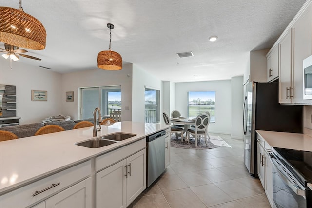 14267 Heritage Landing Blvd Unit 1223, Punta Gorda, FL 33955 - kitchen with appliances with stainless steel finishes, a sink, decorative light fixtures, light countertops, and recessed lighting