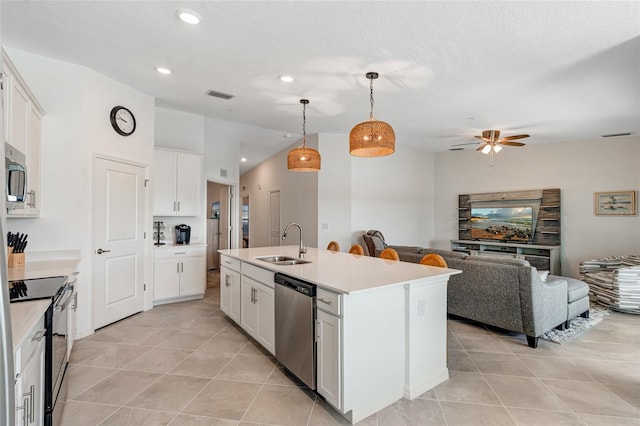 14267 Heritage Landing Blvd Unit 1223, Punta Gorda, FL 33955 - kitchen featuring stainless steel appliances, a sink, light tile patterned floors, open floor plan, and light countertops