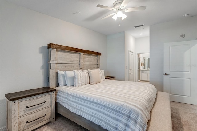 14267 Heritage Landing Blvd Unit 1223, Punta Gorda, FL 33955 - bedroom featuring light carpet, ensuite bathroom, and a ceiling fan