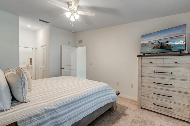 14267 Heritage Landing Blvd Unit 1223, Punta Gorda, FL 33955 - bedroom featuring light colored carpet, baseboards, ensuite bathroom, and ceiling fan
