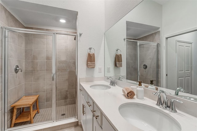14267 Heritage Landing Blvd Unit 1223, Punta Gorda, FL 33955 - bathroom featuring a stall shower, double vanity, recessed lighting, and tile patterned floors