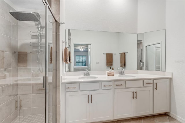 14267 Heritage Landing Blvd Unit 1223, Punta Gorda, FL 33955 - ensuite bathroom with a stall shower, double vanity, and tile patterned floors