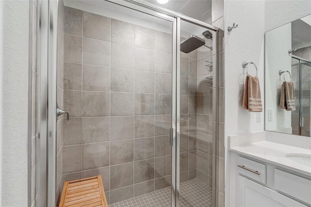 14267 Heritage Landing Blvd Unit 1223, Punta Gorda, FL 33955 - bathroom with a shower stall, vanity, and a textured wall
