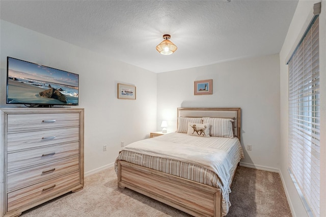 14267 Heritage Landing Blvd Unit 1223, Punta Gorda, FL 33955 - bedroom with light colored carpet, multiple windows, baseboards, and a textured ceiling