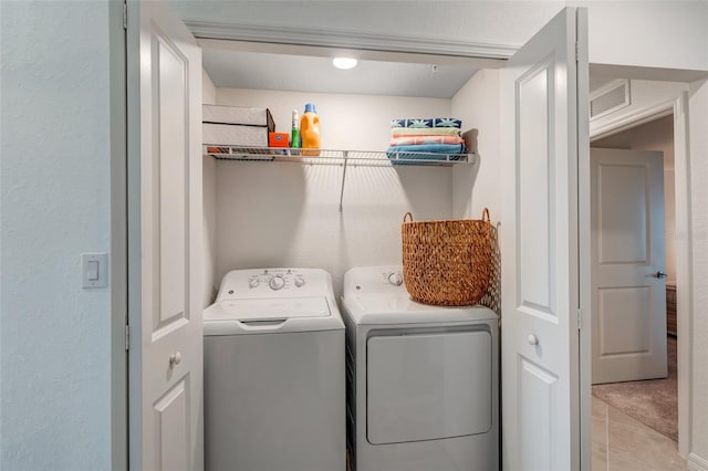 14267 Heritage Landing Blvd Unit 1223, Punta Gorda, FL 33955 - washroom featuring washer and dryer and light tile patterned floors