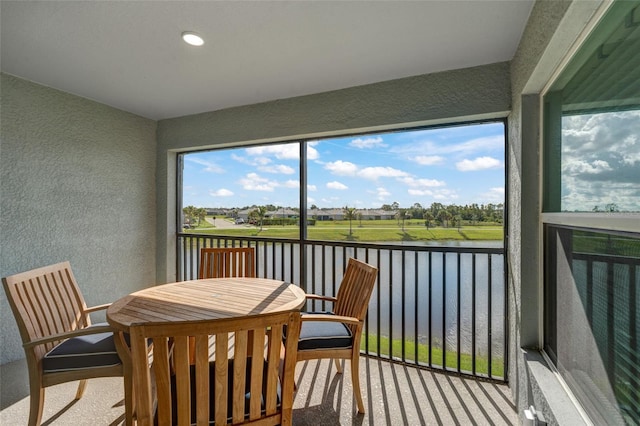14267 Heritage Landing Blvd Unit 1223, Punta Gorda, FL 33955 - sunroom / solarium with a water view and outdoor dining space