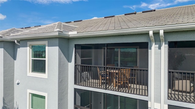 14267 Heritage Landing Blvd Unit 1223, Punta Gorda, FL 33955 - view of property exterior featuring stucco siding and a tiled roof