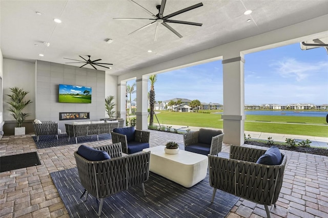 14267 Heritage Landing Blvd Unit 1223, Punta Gorda, FL 33955 - view of patio / terrace featuring an outdoor living space with a fireplace and a ceiling fan