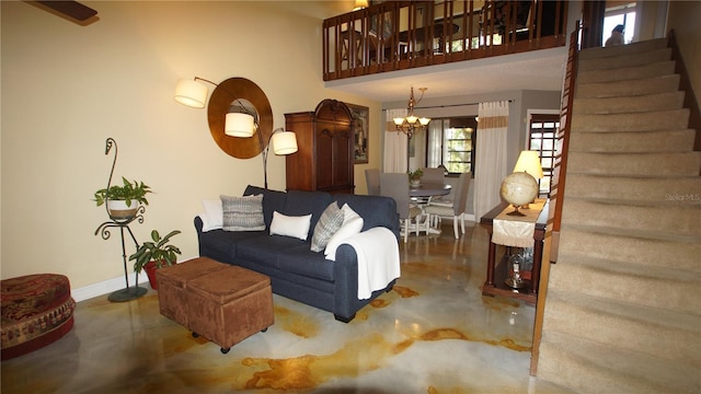 925 Fenton Ln Unit 11, Lakeland, FL 33809 - living room featuring finished concrete floors, stairs, a chandelier, and baseboards