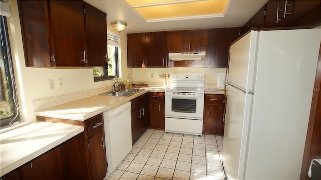 925 Fenton Ln Unit 11, Lakeland, FL 33809 - kitchen featuring white appliances, a sink, under cabinet range hood, light countertops, and light tile patterned flooring