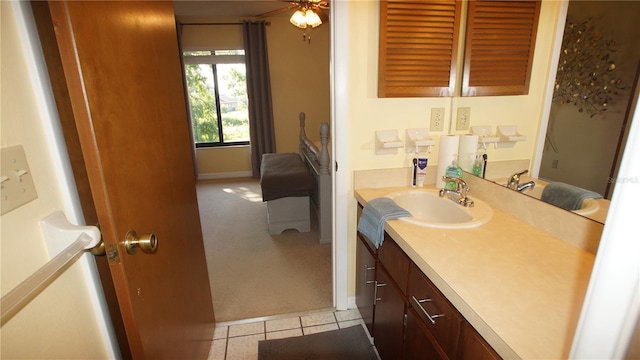 925 Fenton Ln Unit 11, Lakeland, FL 33809 - bathroom featuring vanity, baseboards, tile patterned floors, and ceiling fan