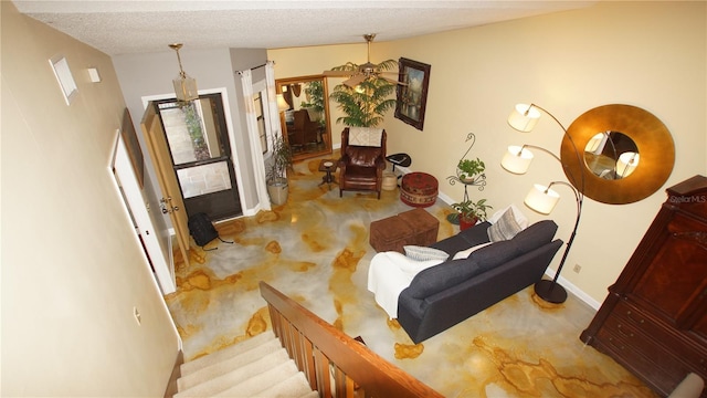 925 Fenton Ln Unit 11, Lakeland, FL 33809 - living area featuring baseboards, a textured ceiling, and stairs