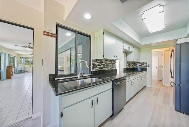 16615 Acapulco Rd, Punta Gorda, FL 33955 - kitchen featuring freestanding refrigerator, a sink, dishwasher, tasteful backsplash, and ceiling fan