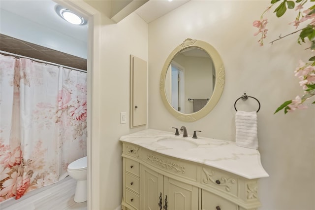 16615 Acapulco Rd, Punta Gorda, FL 33955 - full bathroom featuring toilet, vanity, and a shower with shower curtain