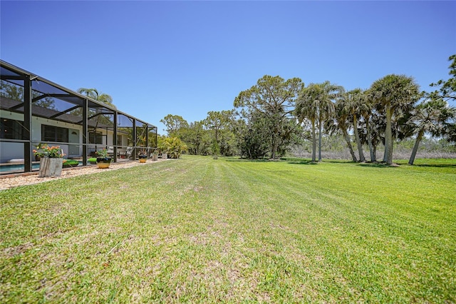 16615 Acapulco Rd, Punta Gorda, FL 33955 - view of grassy yard with a lanai