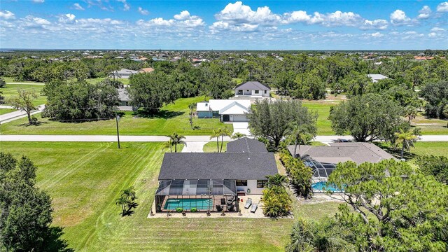 16615 Acapulco Rd, Punta Gorda, FL 33955 - aerial view of residential area featuring a pool area and a tree filled landscape