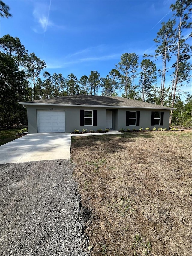 4200 Wanda St, Hastings, FL 32145 - single story home featuring driveway, a garage, and stucco siding