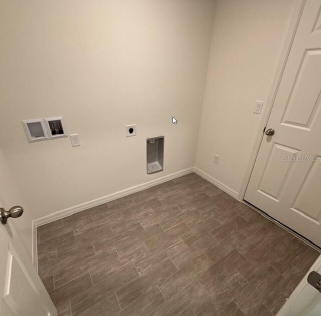 26 Postwood Dr, Palm Coast, FL 32164 - clothes washing area with electric dryer hookup, baseboards, dark wood finished floors, and hookup for a washing machine