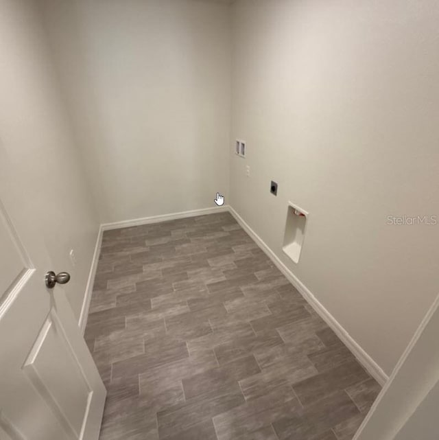 clothes washing area featuring electric dryer hookup, baseboards, and hookup for a washing machine