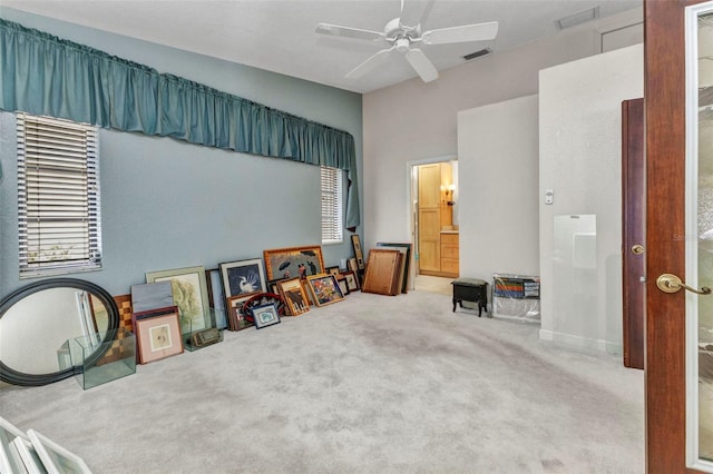 5046 San Rocco Ct, Punta Gorda, FL 33950 - bedroom featuring carpet floors, multiple windows, ensuite bath, and a ceiling fan