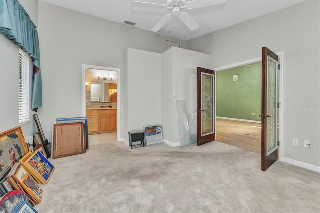 5046 San Rocco Ct, Punta Gorda, FL 33950 - unfurnished bedroom with light carpet, a ceiling fan, ensuite bathroom, baseboards, and a sink