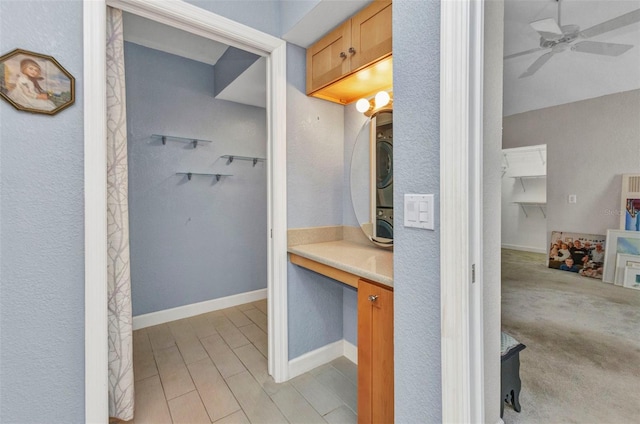 5046 San Rocco Ct, Punta Gorda, FL 33950 - bathroom featuring a walk in closet, a ceiling fan, and vanity
