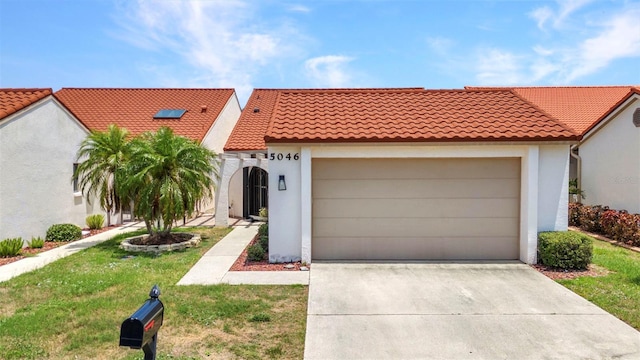 5046 San Rocco Ct, Punta Gorda, FL 33950 - mediterranean / spanish house featuring stucco siding, a tile roof, driveway, an attached garage, and a front lawn