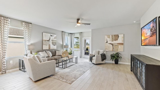 4967 Tuscola Blvd, North Port, FL 34287 - living room with light wood-style flooring, a ceiling fan, and baseboards