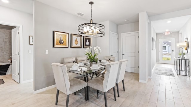 4967 Tuscola Blvd, North Port, FL 34287 - dining area with a chandelier, baseboards, light wood finished floors, and recessed lighting